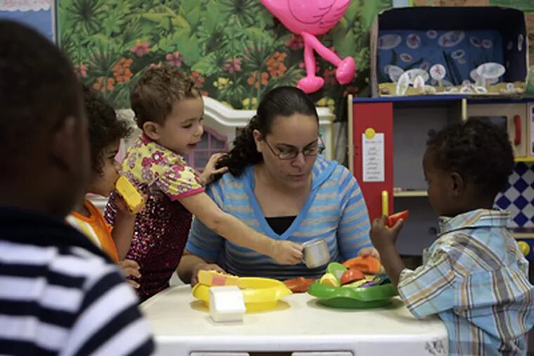 Annette Mercado, director of day care, plays at Kid-Doodles Learning Center in Ambler, where some children are state-subsidized. Montgomery County has approved funding for such centers. (Bonnie Weller / Staff Photographer)