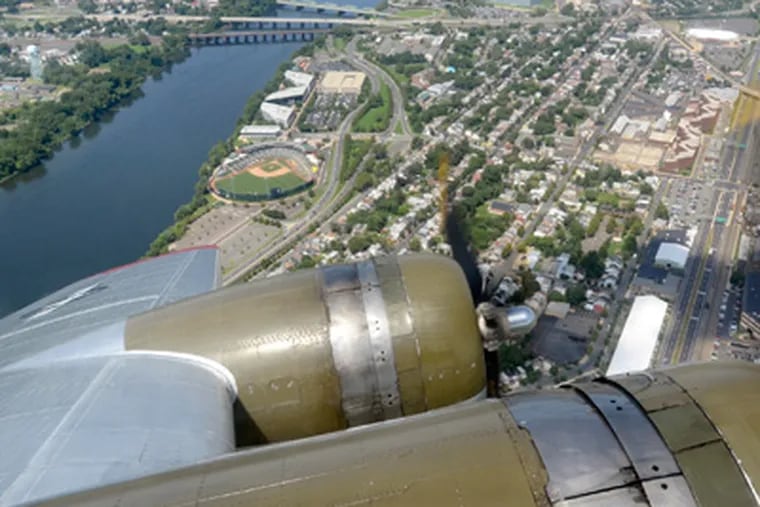 A restored B-17 “Flying Fortress" makes a flight over Trenton on Aug. 13, 2012. (Tom Gralish / Staff Photographer)
