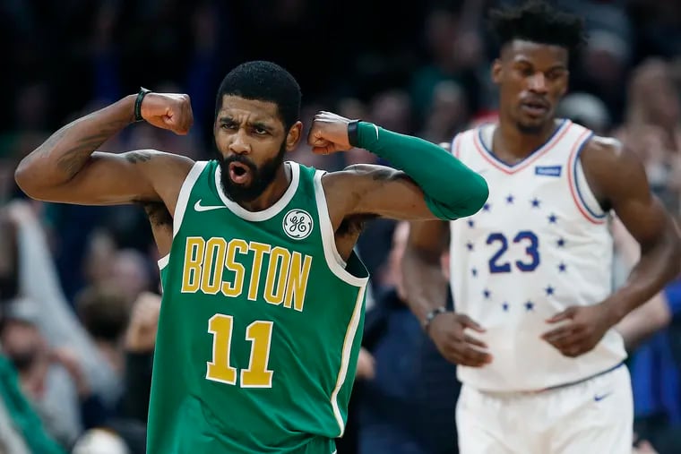 Boston Celtics guard Kyrie Irving (11) reacts in front of Philadelphia 76ers guard Jimmy Butler after making a 3-pointer in overtime.