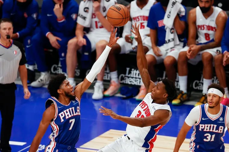 Sixers guard Isaiah Joe blocks Pistons guard Saben Lee's shot attempt.