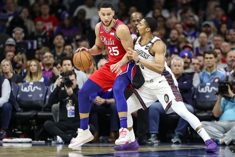 Sixers guard Ben Simmons posts up against Brooklyn Nets' Spencer Dinwiddie in a game on Jan. 15.