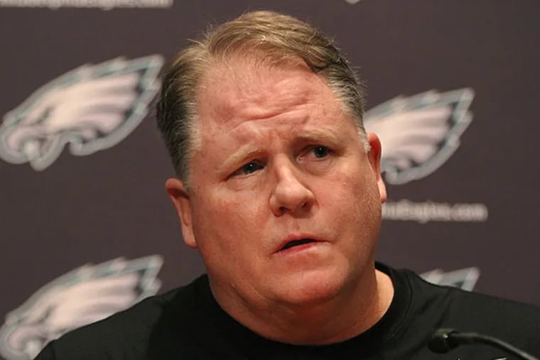 Eagle head coach Chip Kelly listens to a question about the moves he
and the team made over the past few days. (Michael Bryant/Staff Photographer)