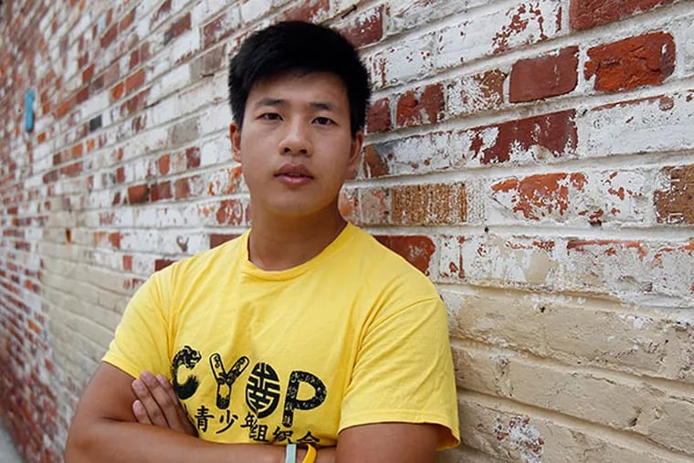 Wei Chen, who was instrumental in the 2010 protests at South Philly High against racial violence against Asian students, is one of 50 finalists up for the Peace First Prize, a $50,000 fellowship that honors young people who are engaged in peace-making projects in their community. He is pictured here in Philadelphia on August 19, 2013. ( DAVID MAIALETTI / Staff Photographer )