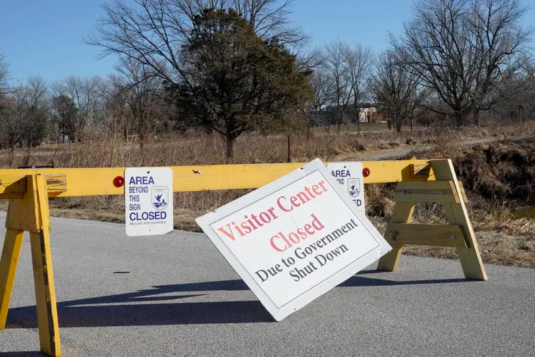 Signs announce the visitor center at the DeSoto National Wildlife Refuge in Missouri Valley, Iowa, is closed, Friday, Jan. 4, 2019, as the partial government shutdown continues. The U.S. Fish and Wildlife Service is directing dozens of wildlife refuges to return to work to make sure hunters and others have access despite the government shutdown, according to an email obtained Wednesday by The Associated Press. (AP Photo/Nati Harnik)