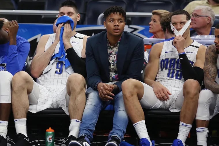 Orlando Magic players Nikola Vucevic (9), Markelle Fultz (middle) and Aaron Gordon (00) are dejected on the bench against the Toronto Raptors during Game Four of the First Round of the NBA Playoffs on Sunday, April 21, 2019 at the Amway Center in Orlando, Fla. (Stephen M. Dowell/Orlando Sentinel/TNS)
