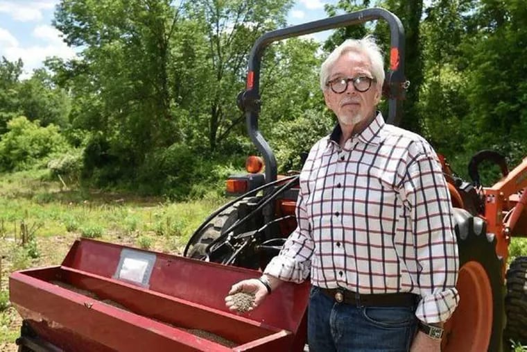 Geoff Whaling, president of the Pennsylvania Hemp Industry Council, holds hemp seeds before planting on Lehigh University property in Upper Saucon Township in June.
