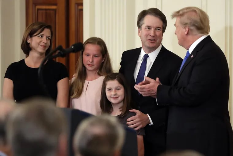 President Donald Trump greets Judge Brett Kavanaugh his Supreme Court nominee on July 9, 2018. Watching is wife Ashley, with daughters Margaret, second from left, and Eliza.