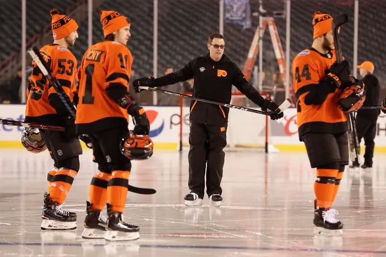 Scott Gordon (center) has positioned the Flyers to be on the cusp of the NHL playoffs.