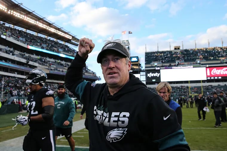 Eagles head coach Doug Pederson pumps his fist to fans at Lincoln Financial Field after his team's 22-14 over the Chicago Bears.