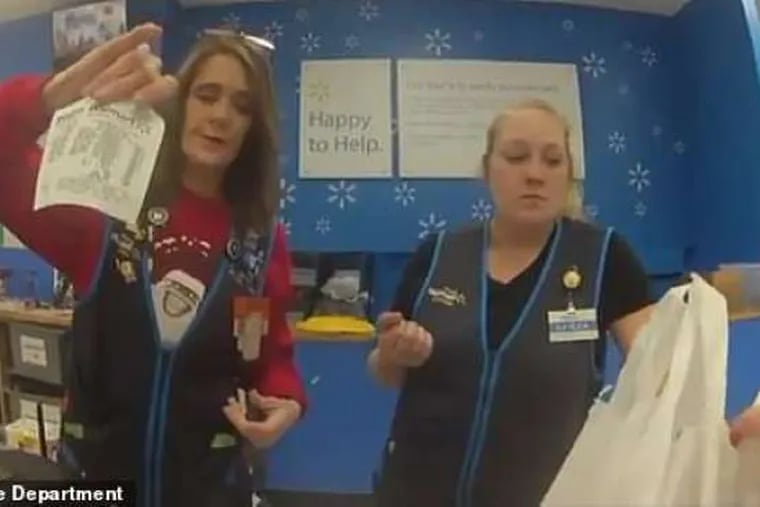 Footage from Officer Kenneth Martin's body camera shows Walmart employees bagging items that he paid for and gave to a family who had been accused of trying to shoplift from the store.