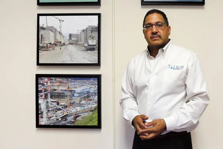 Robert Bright, founder and president of Talson Solutions, poses with photos of the new third lock of the Panama Canal in his office in Philadelphia, PA on August 2, 2016. DAVID MAIALETTI / Staff Photographer