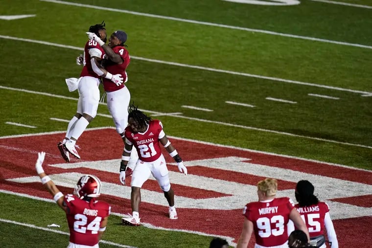 Indiana's Noah Pierre (21) and teammates celebrate after defeating Penn State.