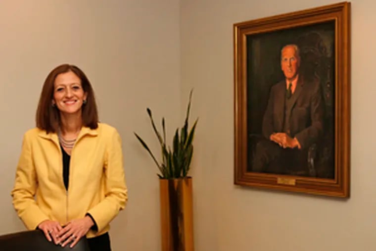 Nina Gussack in a Pepper Hamilton boardroom next to a portrait of Ernest Scott, one of her predecessors. She says Pepper Hamilton offers female lawyers varied paths to success.