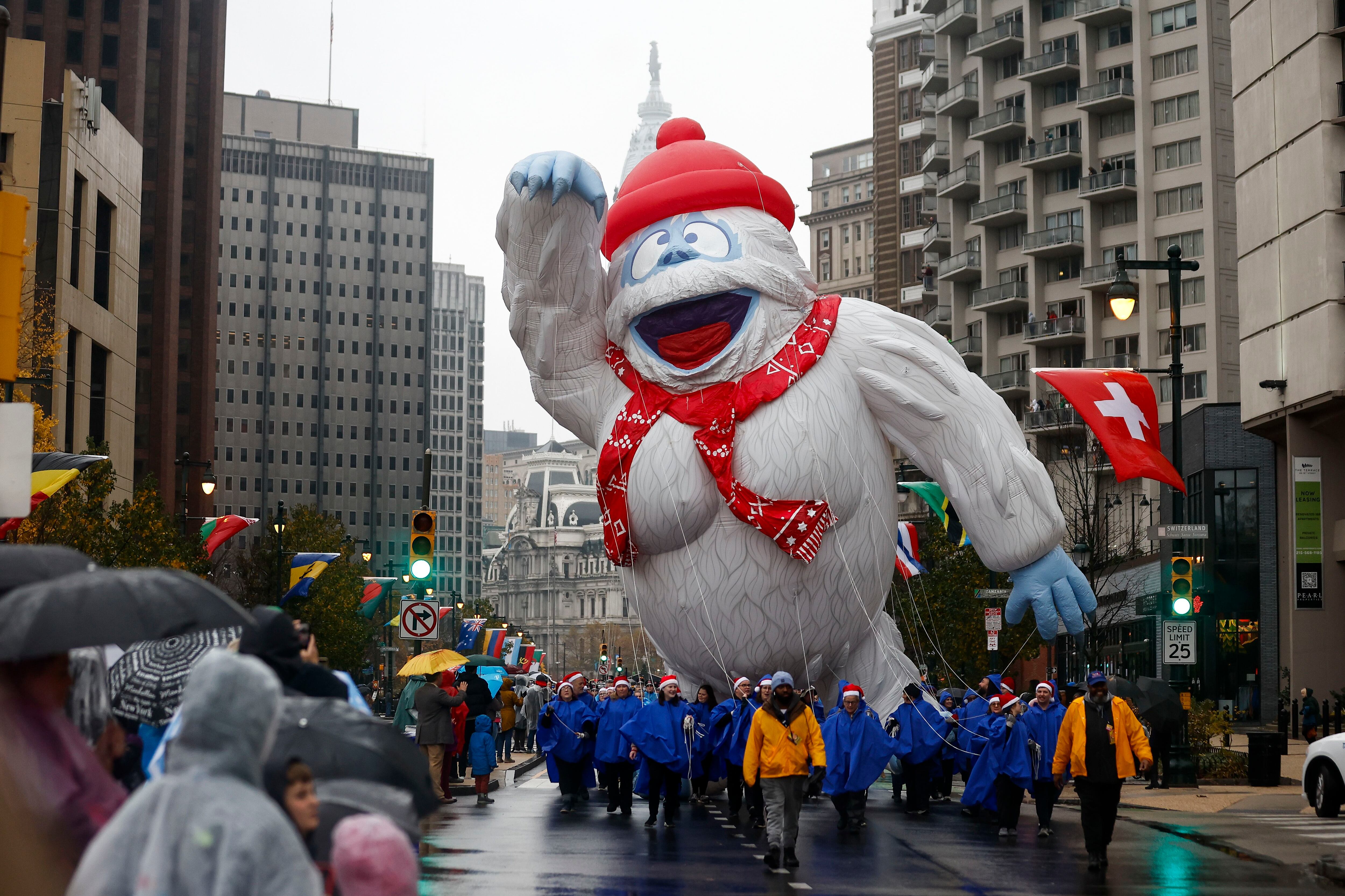 The annual Thanksgiving Day parade leaves folks wet but delighted