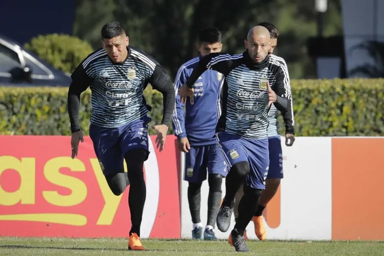 Javier Mascherano (right) and Marcos Rojo attend a training session with the Argentine national soccer squad in Buenos Aires, Argentina, Wednesday, May 23, 2018. Argentina will face Haiti on May 29 in an international friendly soccer match ahead of the FIFA Russia World Cup.