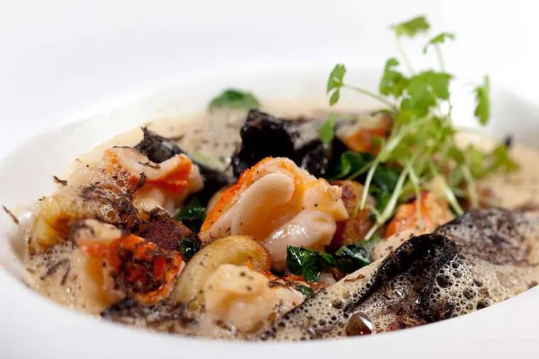 Lobster and gnocchi, with black trumpet mushrooms, pea leaves, sauce American, black truffle, as served at Fond.
