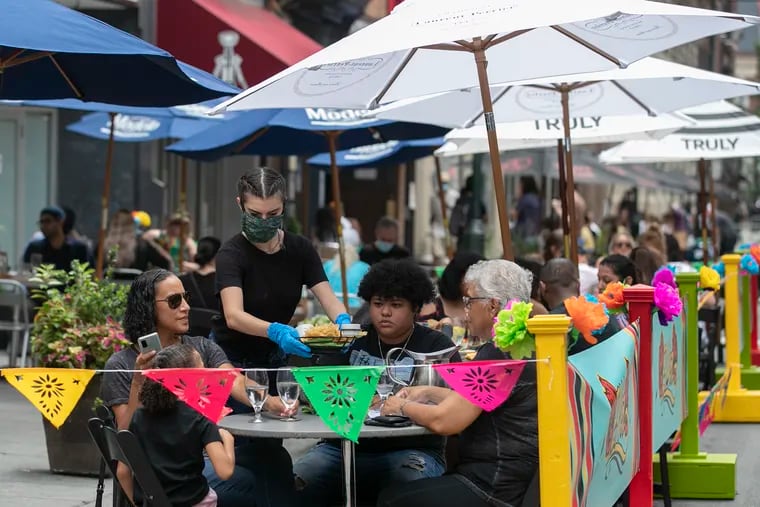 People dine at El Vez restaurant in Center City in August.
