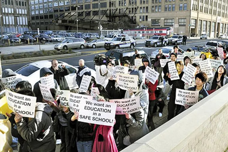 Students and community members walk up Broad Street to protest violence against Asians at South Philadelphia High School on Dec. 9, 2009. (Sarah J. Glover / Staff Photographer)