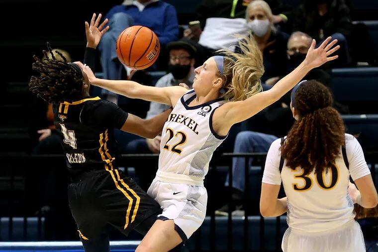 Maura Hendrixson, center,  of Drexel blocks a shot by Aleah Nelson of Towson during the 2nd half at  on Jan. 18, 2022.