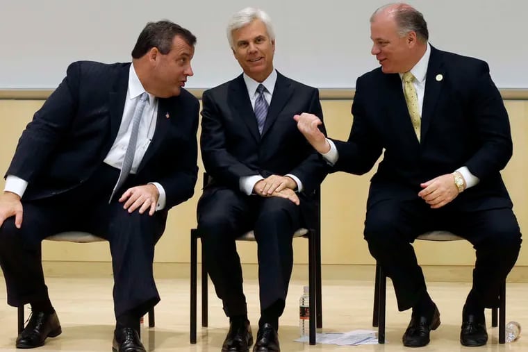 Former Gov. Chris Christie (left) is joined by Democratic power broker George E. Norcross III (center) and Senate President Stephen Sweeney. Many tax breaks have involved projects connected to Norcross.