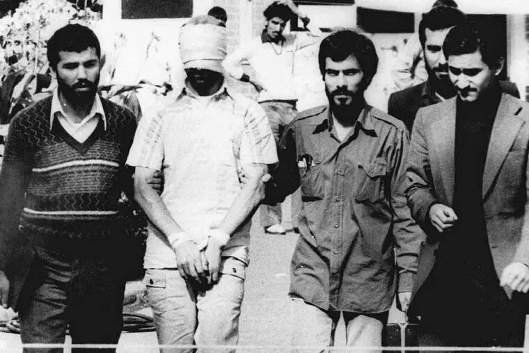 One of the hostages , blindfolded and hands bound, was displayed to a crowd outside the U.S. Embassy in Tehran on Nov. 9, 1979, early in the capture of the 53 Americans.