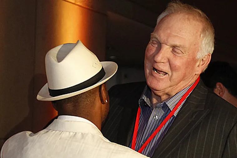 Jimmy Rollins greets Charlie Manuel at a fundraiser in November. Manuel is optimistic Rolllins will return to the Phillies. (Ron Cortes / Staff Photographer)