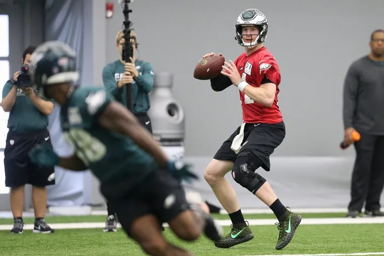 Eagles quarterback Carson Wentz throws a pass during practice at the NovaCare Complex in South Philadelphia on Tuesday.