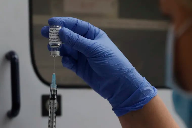 A vial of the Phase 3 Novavax coronavirus vaccine ready for use in the trial at St. George's University hospital in London in 2020.