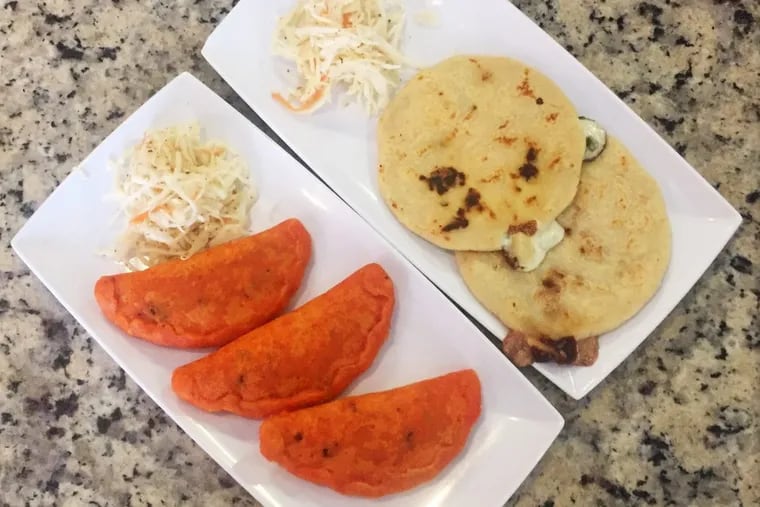 Salvadoran meat pastelitos and pupusas stuffed with cheese and loroco flowers at El Cuscatleca in Upper Darby.