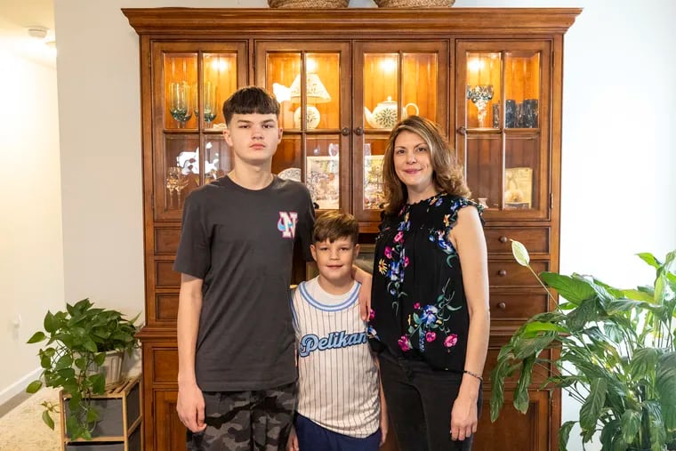 Courtney Pelikan, 42, and her children Grayson, 14, and Odin, 9, at their home in Bordentown.