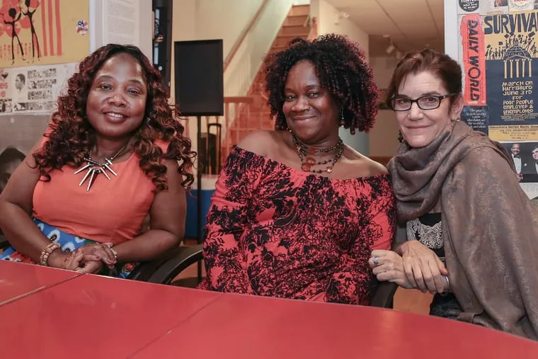 Left to right, Liberian singers Zaye Tete and Fatu Gayflor, and filmmaker Toni Shapiro-Phim at the gallery of the Philadelphia Folklore Project in West Philadelphia. The Liberian singers are the subject of a new documentary, Because of the War, produced by the folklore project and premiering here on Sunday Oct. 15.