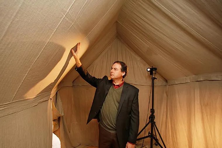 R. Scott Stephenson, project director, checks an interior ceiling of the replica of George Washington's wartime field tent on December 3,  2013.( MICHAEL S. WIRTZ / Staff Photographer )