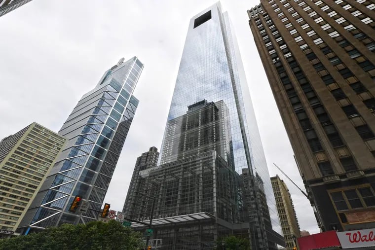Comcast Center and Comcast Technology Center, left, are shown in Center City Philadelphia. Developer Liberty Property Trust plans to sell its stake in these buildings as part of a shift to focus on industrial properties.