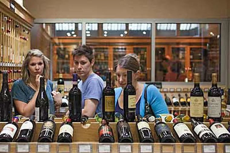 The state's only boutique wine shop is in the Garces Trading Company on Locust Street. A lawsuit, filed by competitors, says the singular arrangement is favoritism by the LCB. (DAVID M WARREN / Staff Photographer)