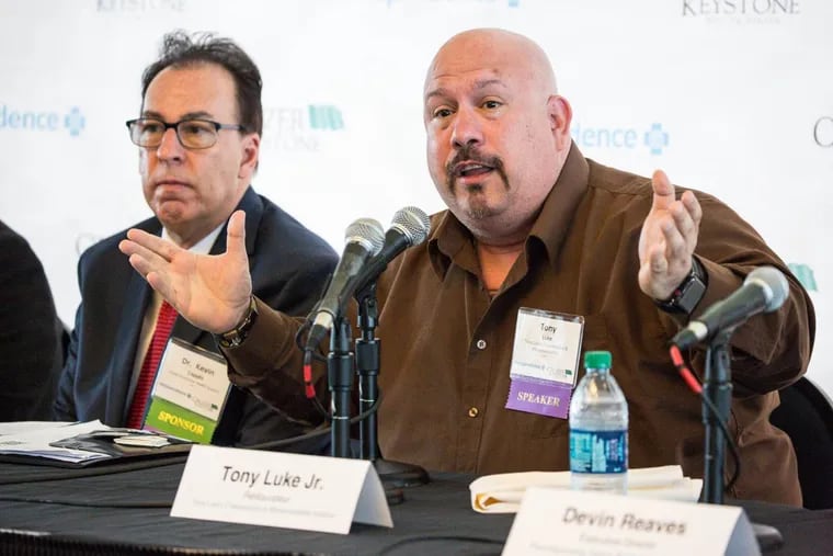 Tony Luke, right, speaks at the Philadelphia Media Network and Independence Blue Cross educational program about the impact of opioids in our community, Dr. Kevin Caputo, left, in Philadelphia, Thursday, May 17, 2018.
