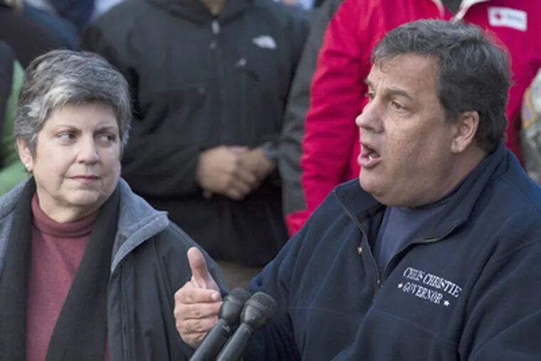 Gov. Christie with Homeland Security Secretary Janet Napolitano during Sunday's news conference. (John Minchillo / AP)