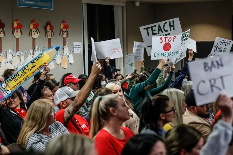 An even mix of proponents and opponents to teaching Critical Race Theory are in attendance as the Placentia-Yorba Linda School Board discusses a proposed resolution to ban it from being taught in schools, on Nov. 16, 2021, in Yorba Linda, California.