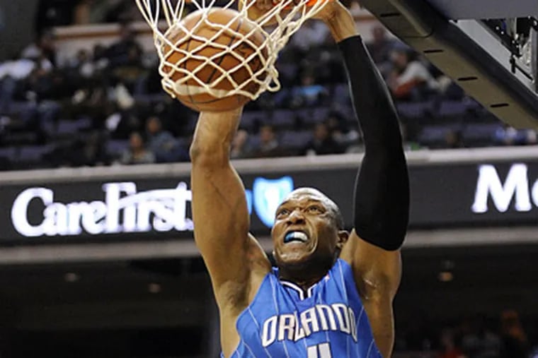 Center Tony Battie, seen here playing with the Orlando Magic, has signed with the Sixers. (AP Photo/Nick Wass)