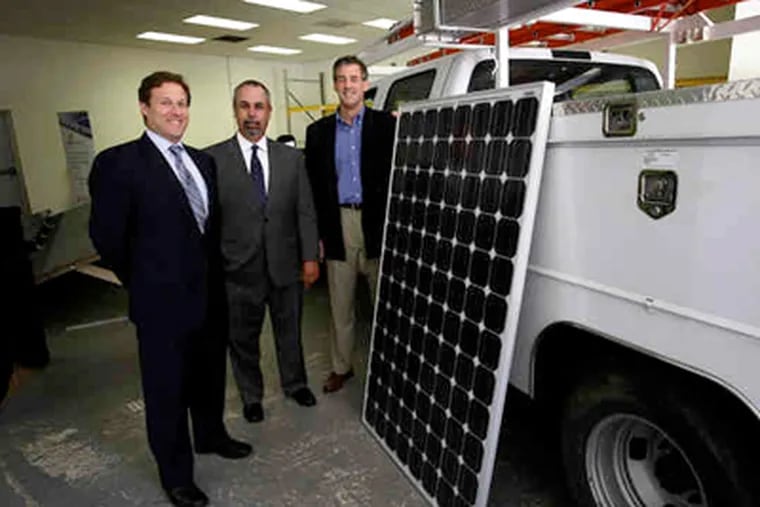 At the new Broomall office of groSolar, which will install the systems, are (from left) Middle Atlantic Solar Leasing partners Adam Stern and John M. Hayes and groSolar's James P. Resor. (Michael S. Wirtz)