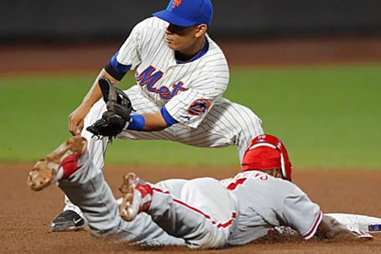 Jimmy Rollins slides into second base during the Phillies' loss. (Paul J. Bereswill/AP)