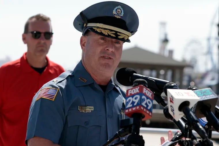 Ocean City Mayor Jay Gillian (left) listens to Ocean City Police Chief Jay Prettyman during Thursday's news conference at the music pier. After a weekend of what Ocean City leadership are calling "unruly teen behavior," new policies are being put in place including moving up curfew times and backpack bans.