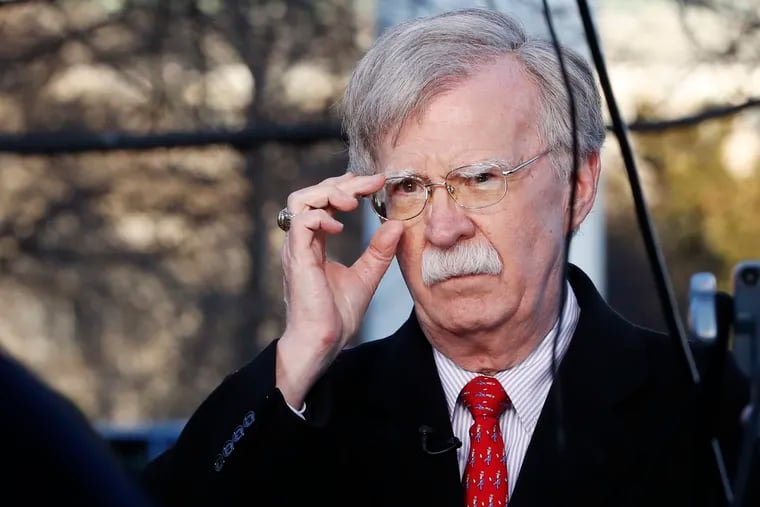 In this March 5, 2019, file photo, U.S. national security adviser John Bolton adjusts his glasses before an interview at the White House in Washington. North Korea has issued a relatively mild criticism of White House national security adviser John Bolton over a recent interview he gave. State media on Saturday cited First Vice Foreign Minister Choe Son Hui as criticizing Bolton for telling Bloomberg News that the U.S. would need more evidence of North Korea’s disarmament commitment before a third leaders’ summit.