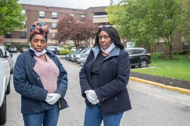 Da'nae Frazier, left, and Davetta Frazier stand in front of the Maplewood Nursing & Rehabilitation Center, where Brenda Frazier, their grandmother and mother, respectively, was a resident before being sent to the hospital with coronavirus.