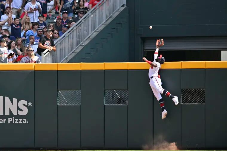 Atlanta Braves center fielder Michael Harris cannot prevent a solo homer by Alec Bohm in the sixth inning, which broke up a no-hitter.