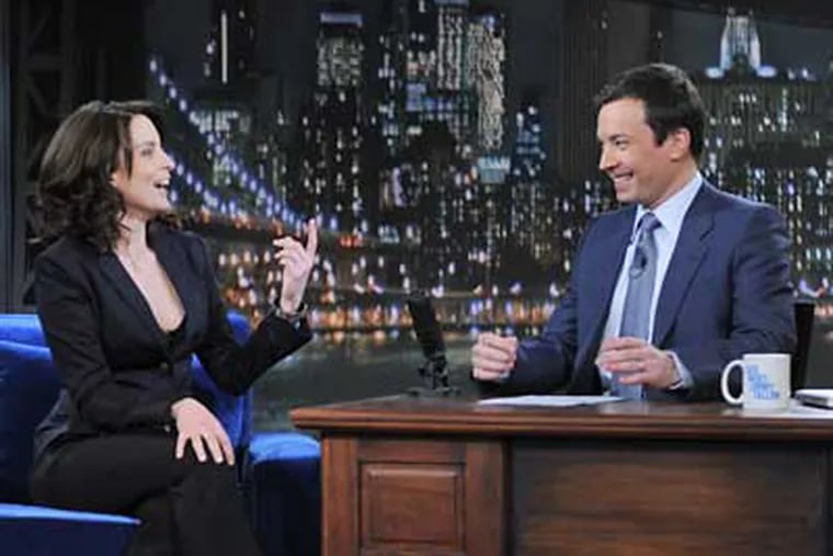 Jimmy Fallon, right, interviews Upper Darby native Tina Fey in his first days as Conan O'Brien's replacement. (Dana Edelson / NBC Photo)