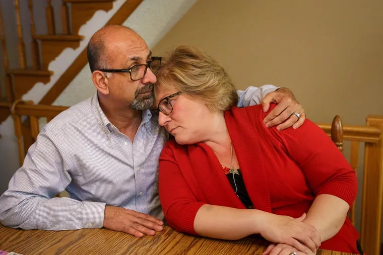 Amr Osman, left, with his wife Lea DiRusso at her South Philadelphia home, November 7, 2019. DiRusso was diagnosed with mesothelioma in August after being exposed to asbestos while working in two South Philadelphia elementary schools for the past 30 years.