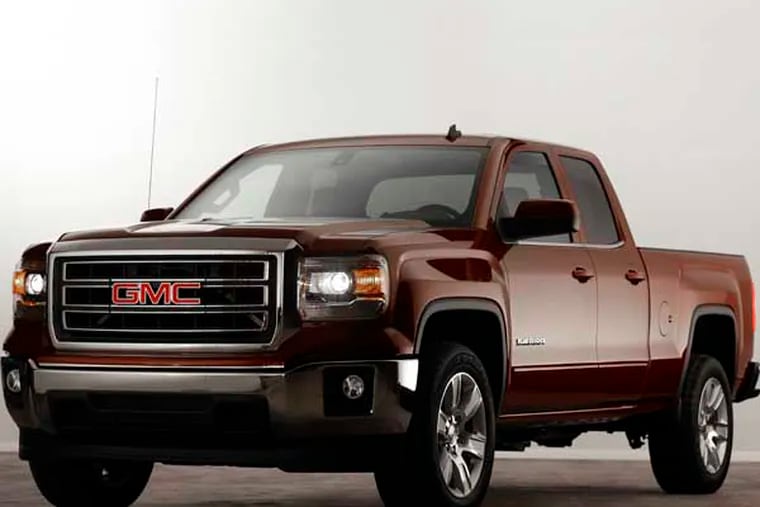 The 2014 GMC Sierra SLE debuts in Pontiac, Mich., Thursday, Dec. 13, 2012. General Motors unveiled the new versions of its top-selling Chevrolet Silverado and Sierra Thursday. The models roll into a market where truck sales are growing after a five-year slump.( AP Photo/Paul Sancya)