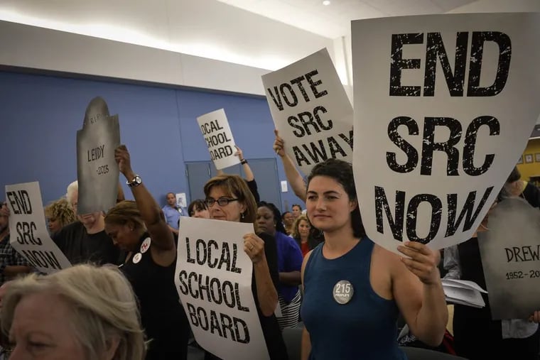 In June, demonstrators made their feelings known about the School Reform Commission at the SRC’s final meeting of the 2016-17 school year.