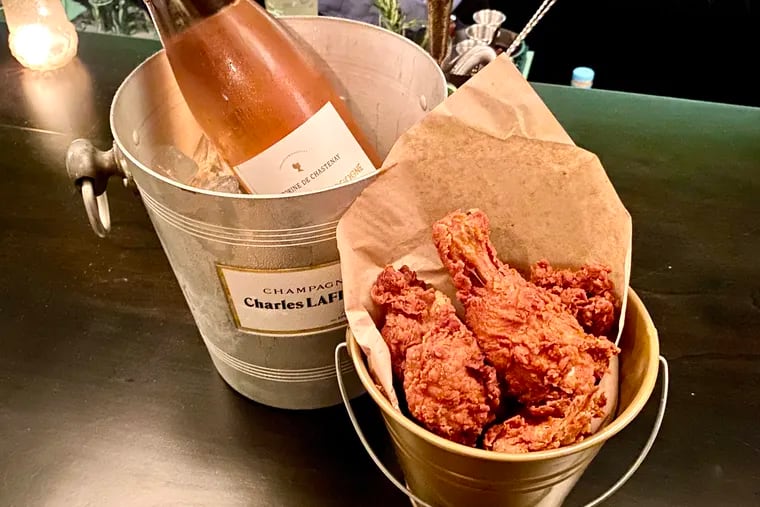 Buckets bearing champagne and fried chicken are the lure at Bar Poulet, 2005 Walnut St.