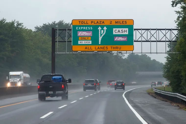 Motorists drive down the New Jersey Turnpike in Carneys Point, N.J.